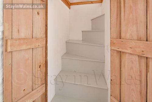 Stairs to the mezzanine from the double bedroom
