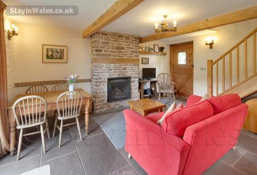 The living area has an open fire and freeview television