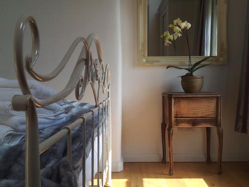 Comfortable Laura Ashley bed and sprung mattress